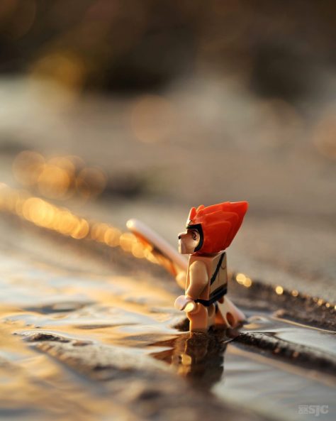 Lego Leonidas about to go surfing at sunset WM